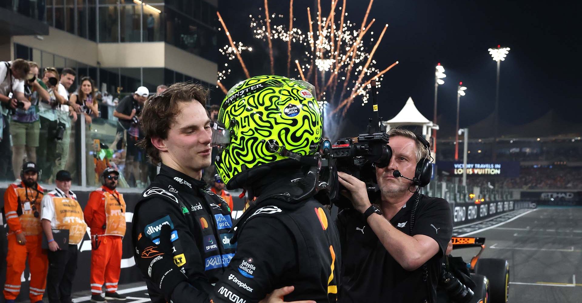 ABU DHABI, UNITED ARAB EMIRATES - DECEMBER 07: 2025 F1 World Drivers Champion and Third placed Lando Norris of Great Britain and McLaren is congratulated by Second placed Oscar Piastri of Australia and McLaren in parc ferme during the F1 Grand Prix of Abu Dhabi at Yas Marina Circuit on December 07, 2025 in Abu Dhabi, United Arab Emirates. (Photo by Steven Tee/LAT Images)