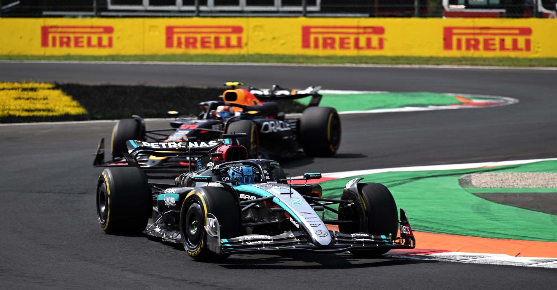 AUTODROMO NAZIONALE MONZA, ITALY - AUGUST 31: George Russell, Mercedes F1 W15, leads Sergio Perez, Red Bull Racing RB20 during the Italian GP at Autodromo Nazionale Monza on Saturday August 31, 2024 in Monza, Italy. (Photo by Simon Galloway / LAT Images)