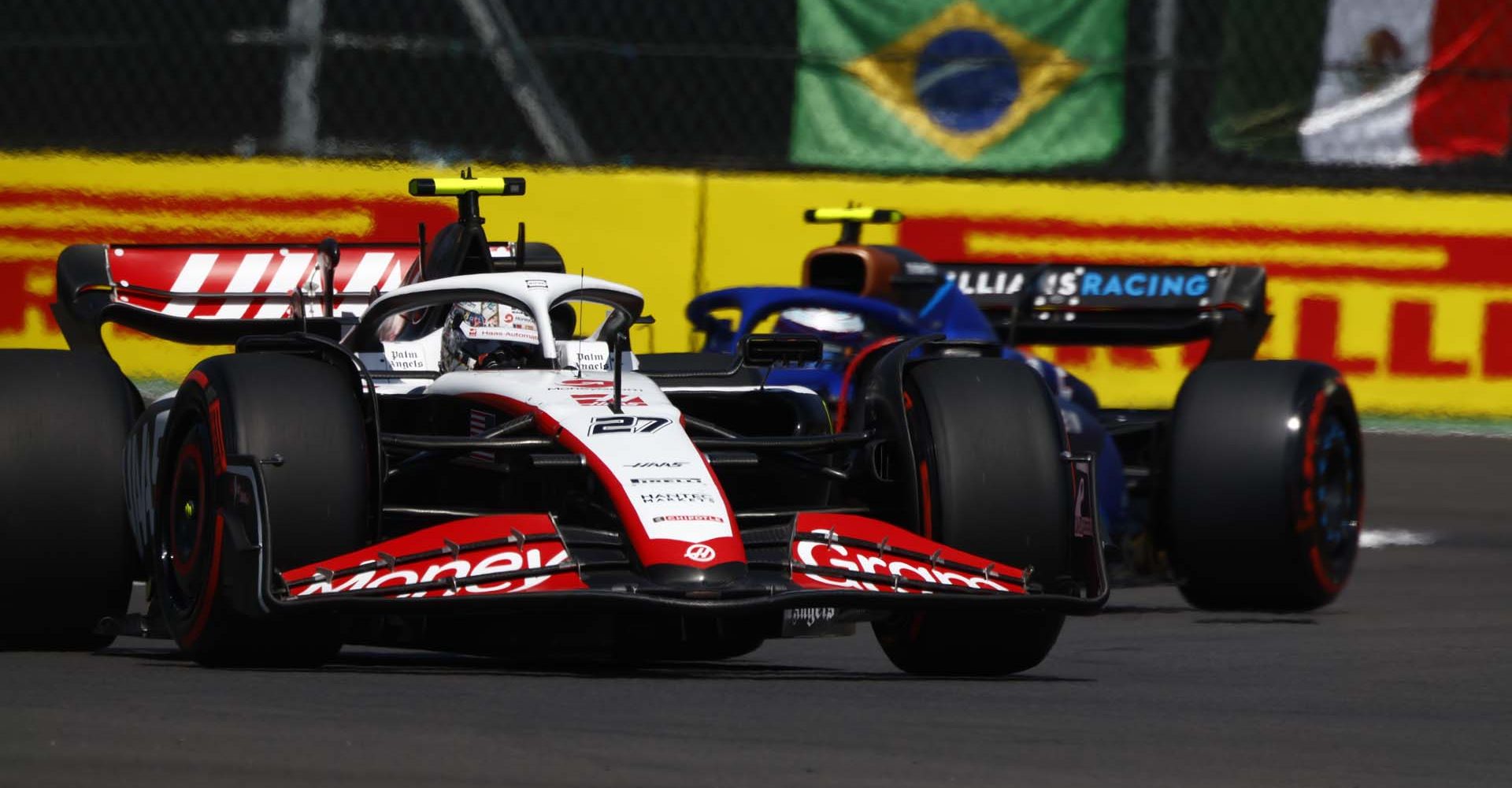 AUTODROMO HERMANOS RODRIGUEZ, MEXICO - OCTOBER 28: Nico Hulkenberg, Haas VF-23, leads Logan Sargeant, Williams FW45 during the Mexico City GP at Autodromo Hermanos Rodriguez on Saturday October 28, 2023 in Mexico City, Mexico. (Photo by Sam Bloxham / LAT Images)