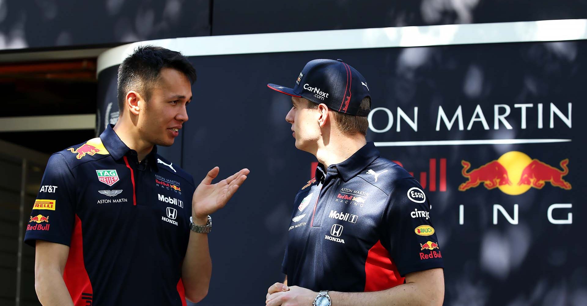 MELBOURNE, AUSTRALIA - MARCH 12: Max Verstappen of Netherlands and Red Bull Racing and Alexander Albon of Thailand and Red Bull Racing talk outside the Red Bull Racing garage during previews ahead of the F1 Grand Prix of Australia at Melbourne Grand Prix Circuit on March 12, 2020 in Melbourne, Australia. (Photo by Charles Coates/Getty Images) // Getty Images / Red Bull Content Pool  // AP-23CGKUXS52111 // Usage for editorial use only //