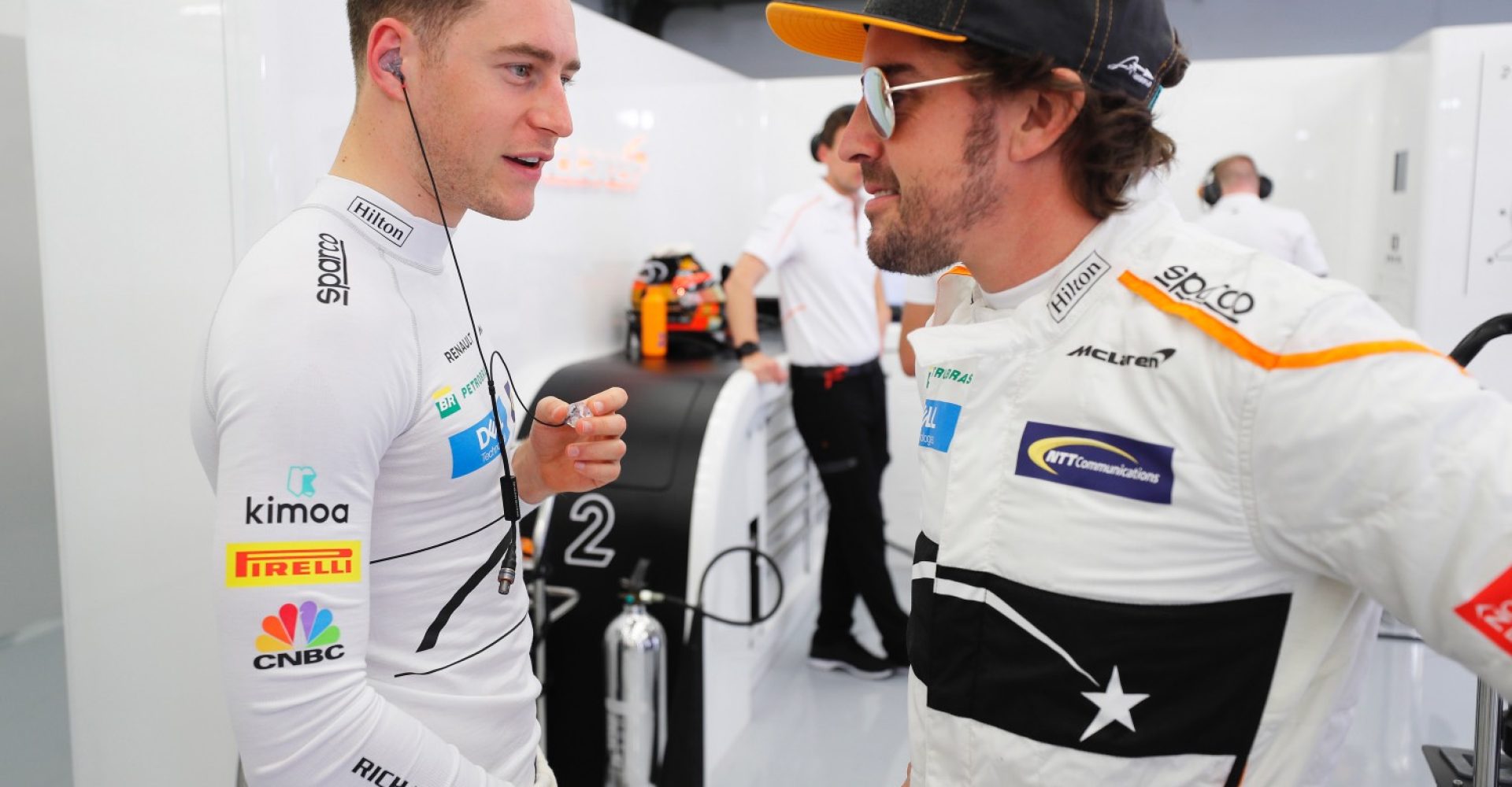 Bahrain International Circuit, Sakhir, Bahrain.
Friday 6 April 2018.
Fernando Alonso talks to team-mate Stoffel Vandoorne, in the team's garage.
Photo: Steven Tee/McLaren
ref: Digital Image _1ST8837