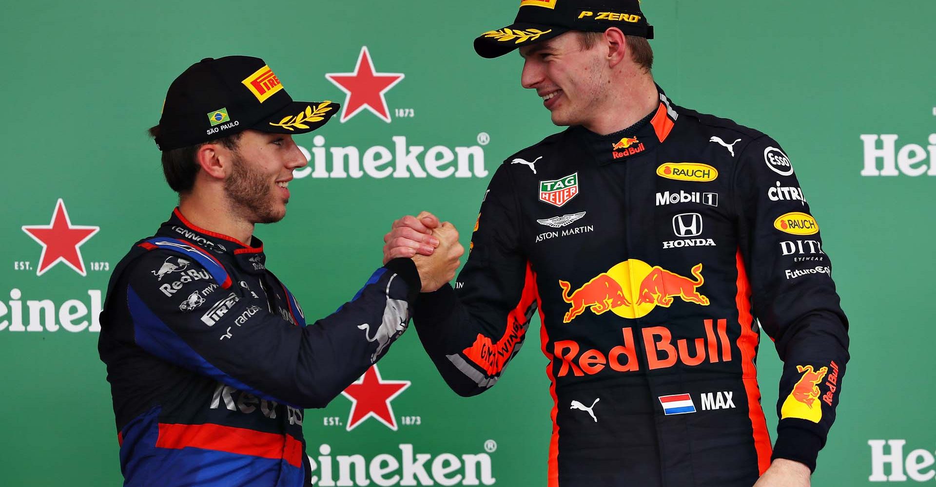 SAO PAULO, BRAZIL - NOVEMBER 17: Race winner Max Verstappen of Netherlands and Red Bull Racing and second placed Pierre Gasly of France and Scuderia Toro Rosso celebrate on the podium during the F1 Grand Prix of Brazil at Autodromo Jose Carlos Pace on November 17, 2019 in Sao Paulo, Brazil. (Photo by Mark Thompson/Getty Images) // Getty Images / Red Bull Content Pool  // AP-227E6KM1S2111 // Usage for editorial use only //