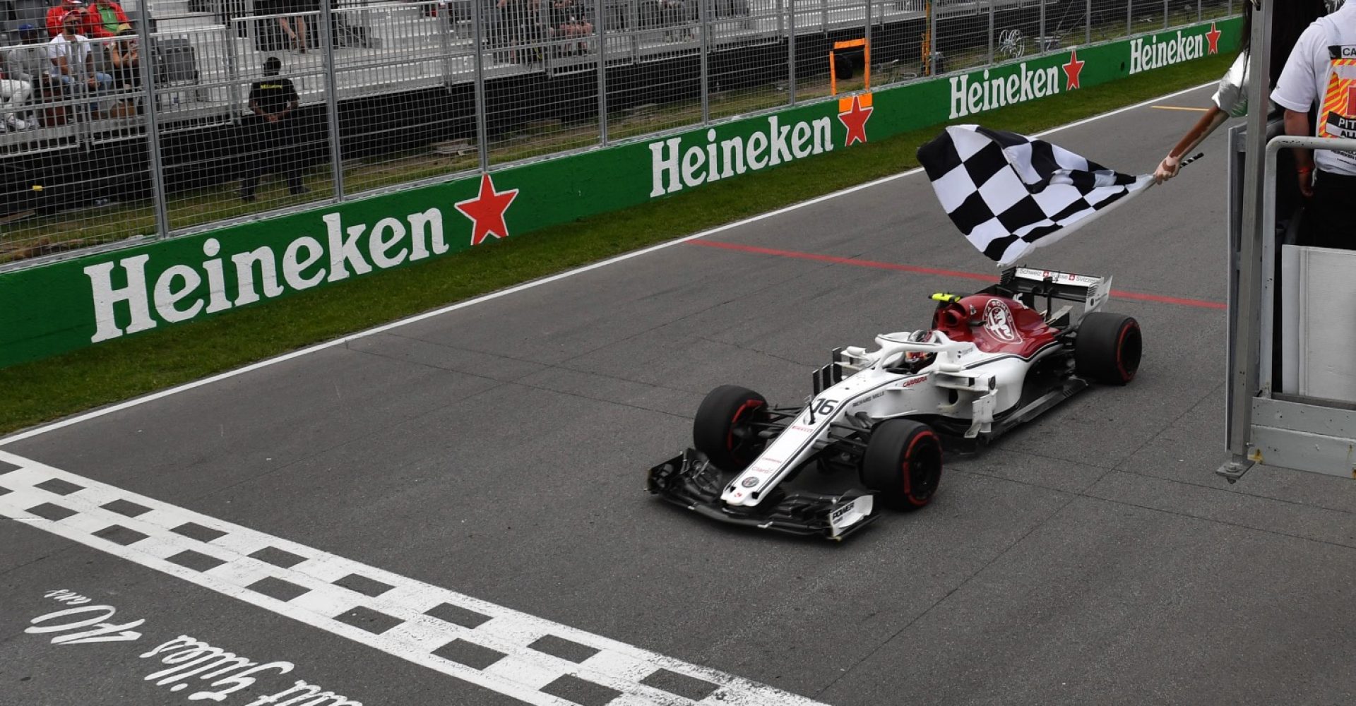 Charles Leclerc (MON) Alfa Romeo Sauber C37 takes the chequered flag waved by Winnie Harlow (CDN) at Formula One World Championship, Rd7, Canadian Grand Prix, Race, Montreal, Canada, Sunday10 June 2018.