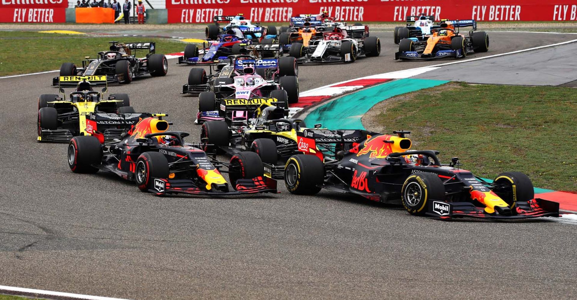 SHANGHAI, CHINA - APRIL 14: Max Verstappen of the Netherlands driving the (33) Aston Martin Red Bull Racing RB15 leads Pierre Gasly of France driving the (10) Aston Martin Red Bull Racing RB15 at the start during the F1 Grand Prix of China at Shanghai International Circuit on April 14, 2019 in Shanghai, China. (Photo by Mark Thompson/Getty Images) // Getty Images / Red Bull Content Pool  // AP-1Z1CYAMNH1W11 // Usage for editorial use only // Please go to www.redbullcontentpool.com for further information. //