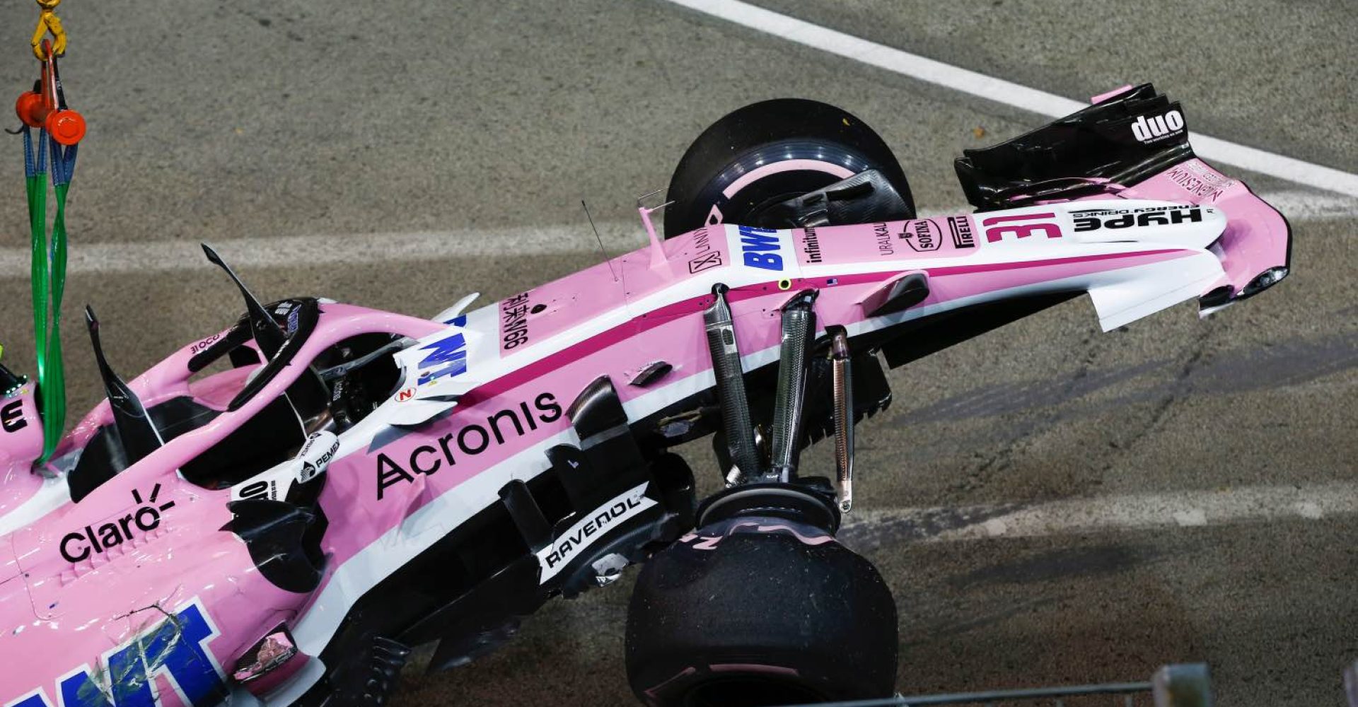 The crashed car of Esteban Ocon, Racing Point Force India VJM11 is recovered at Formula One World Championship, Rd15, Singapore Grand Prix, Race, Marina Bay Circuit, Singapore, Sunday 16 September 2018.