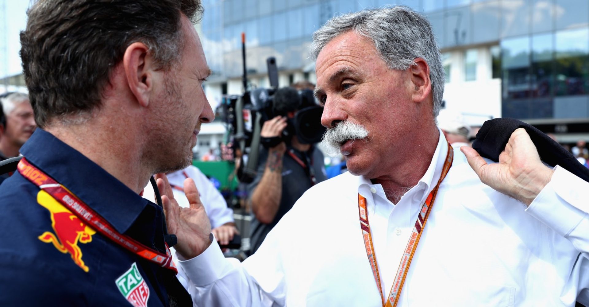 BUDAPEST, HUNGARY - JULY 29: Red Bull Racing Team Principal Christian Horner talks with Chase Carey, CEO and Executive Chairman of the Formula One Group, on the grid before the Formula One Grand Prix of Hungary at Hungaroring on July 29, 2018 in Budapest, Hungary.  (Photo by Mark Thompson/Getty Images)