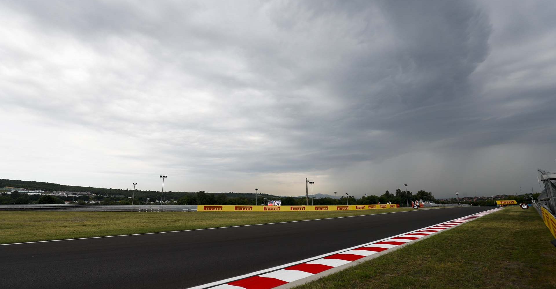 HUNGARORING, HUNGARY - AUGUST 02: Dark clouds over the track during the Hungarian GP at Hungaroring on August 02, 2019 in Hungaroring, Hungary. (Photo by Sam Bloxham / LAT Images)