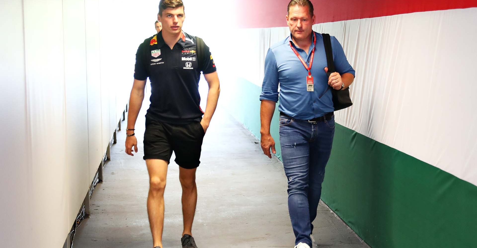 BUDAPEST, HUNGARY - AUGUST 01: Max Verstappen of Netherlands and Red Bull Racing and father Jos Verstappen walk in the Paddock during previews ahead of the F1 Grand Prix of Hungary at Hungaroring on August 01, 2019 in Budapest, Hungary. (Photo by Lars Baron/Getty Images) // Getty Images / Red Bull Content Pool  // AP-214H98EX11W11 // Usage for editorial use only // Please go to www.redbullcontentpool.com for further information. //