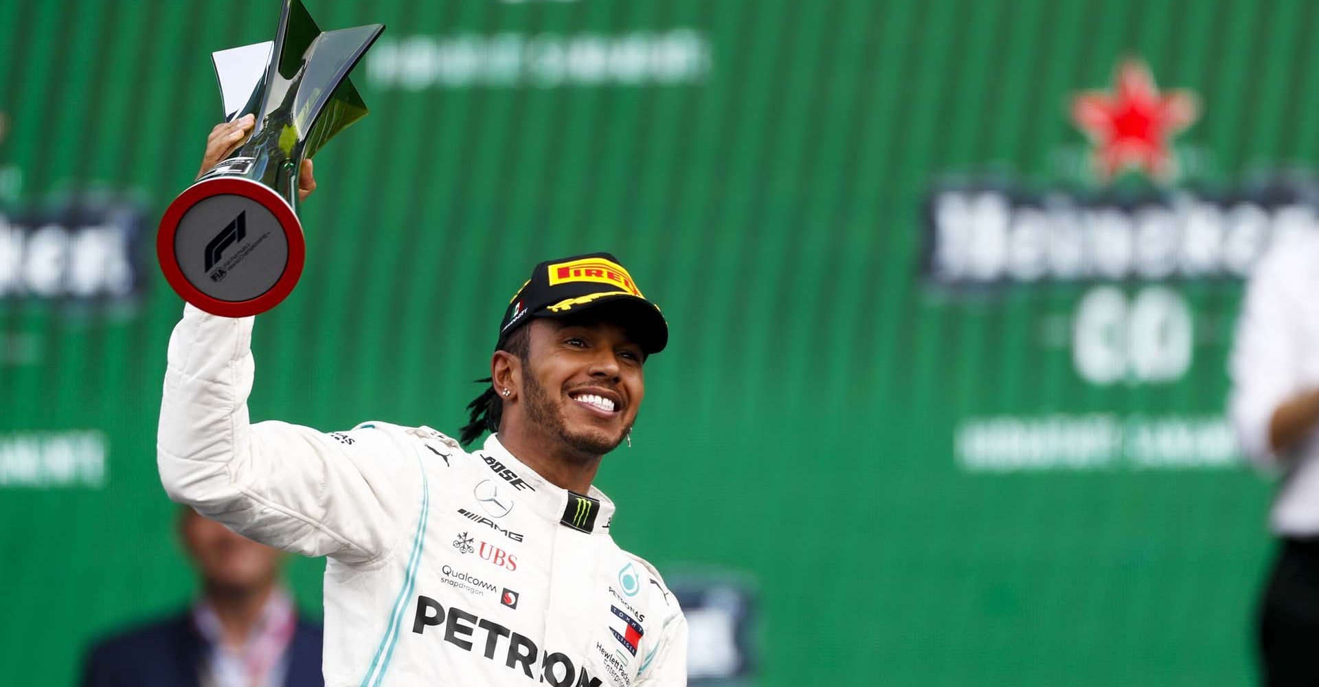 MEXICO CITY - OCTOBER 27: Race winner Lewis Hamilton, Mercedes AMG F1 on the podium with the trophy during the 2019 Formula One Mexican Grand Prix at Autodromo Hermanos Rodriguez, on October 27, 2019 in Mexico City, Mexico. (Photo by Glenn Dunbar / LAT Images)