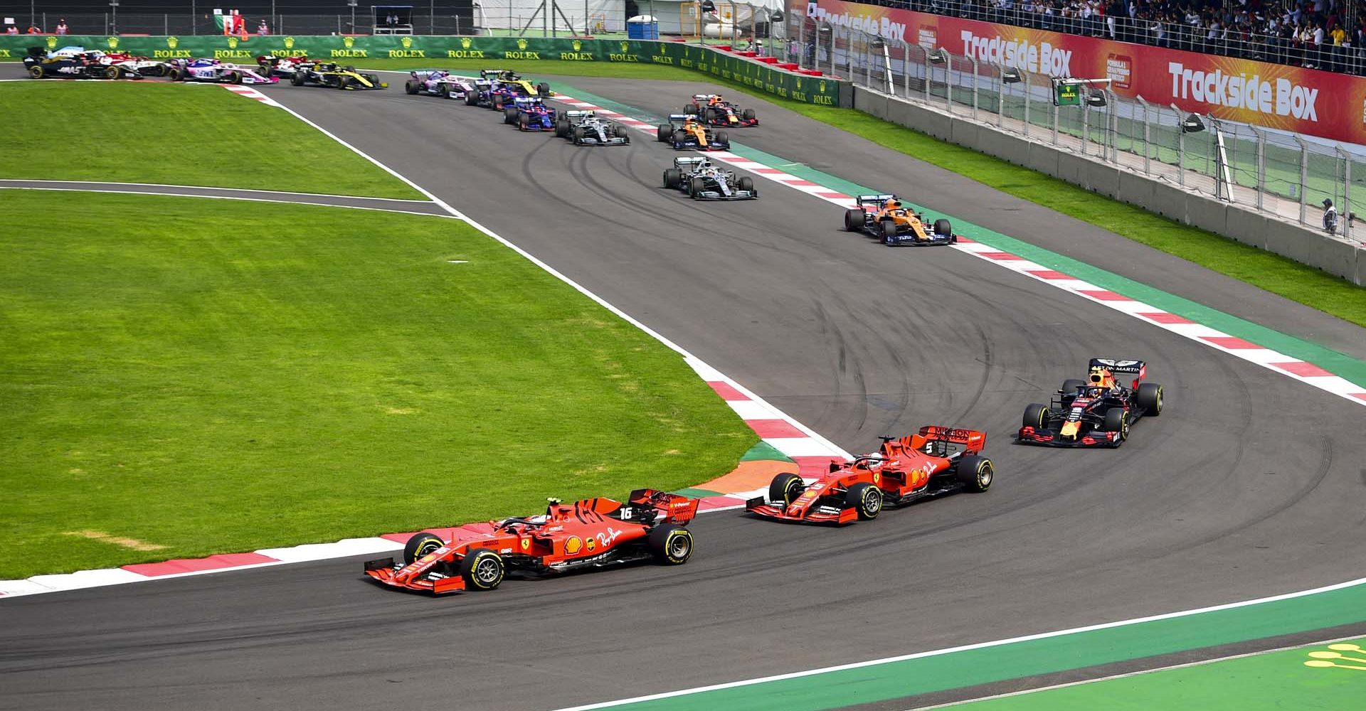 MEXICO CITY - OCTOBER 27: Charles Leclerc, Ferrari SF90 leads Sebastian Vettel, Ferrari SF90 and Alexander Albon, Red Bull RB15 at the start of the race during the 2019 Formula One Mexican Grand Prix at Autodromo Hermanos Rodriguez, on October 27, 2019 in Mexico City, Mexico. (Photo by Simon Galloway / LAT Images)