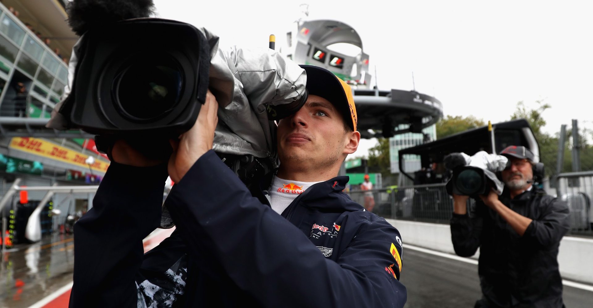 MONZA, ITALY - SEPTEMBER 02:  Max Verstappen of Netherlands and Red Bull Racing uses a TV camera in the Pitlane during qualifying for the Formula One Grand Prix of Italy at Autodromo di Monza on September 2, 2017 in Monza, Italy.  (Photo by Mark Thompson/Getty Images)