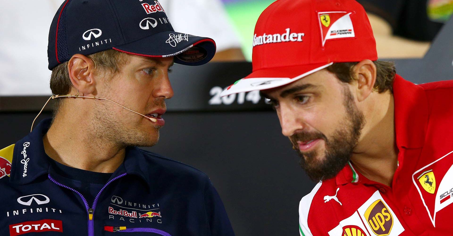 ABU DHABI, UNITED ARAB EMIRATES - NOVEMBER 20:  Fernando Alonso of Spain and Ferrari speaks with Sebastian Vettel of Germany and Infiniti Red Bull Racing during the drivers' press conference during previews ahead of the Abu Dhabi Formula One Grand Prix at Yas Marina Circuit on November 20, 2014 in Abu Dhabi, United Arab Emirates.  (Photo by Mark Thompson/Getty Images) *** Local Caption *** Fernando Alonso;Sebastian Vettel // Getty Images / Red Bull Content Pool // SI201412178903 // Usage for editorial use only //