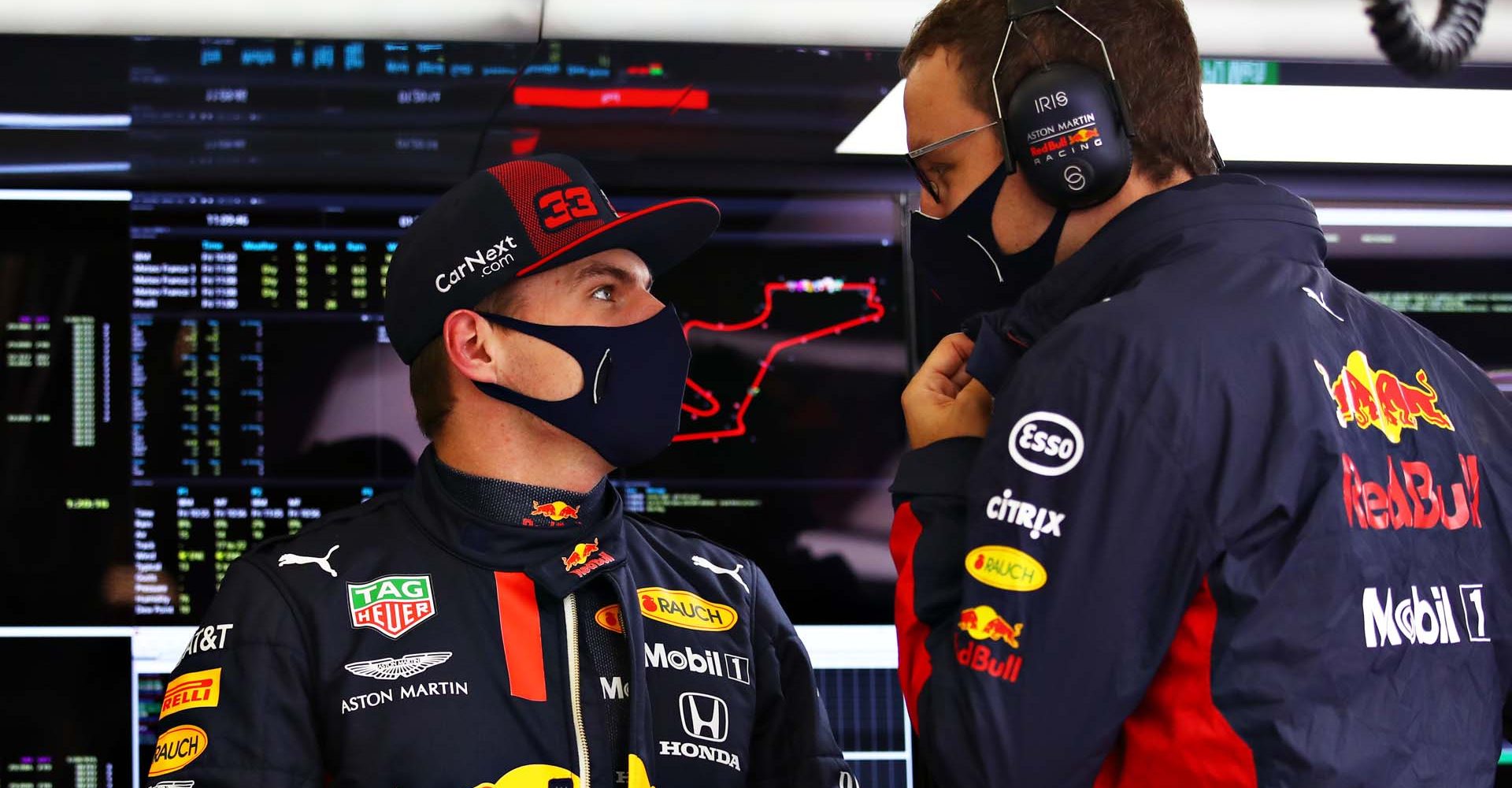 ISTANBUL, TURKEY - NOVEMBER 13: Max Verstappen of Netherlands and Red Bull Racing talks with a Red Bull Racing engineer in the garage during practice ahead of the F1 Grand Prix of Turkey at Intercity Istanbul Park on November 13, 2020 in Istanbul, Turkey. (Photo by Bryn Lennon/Getty Images)