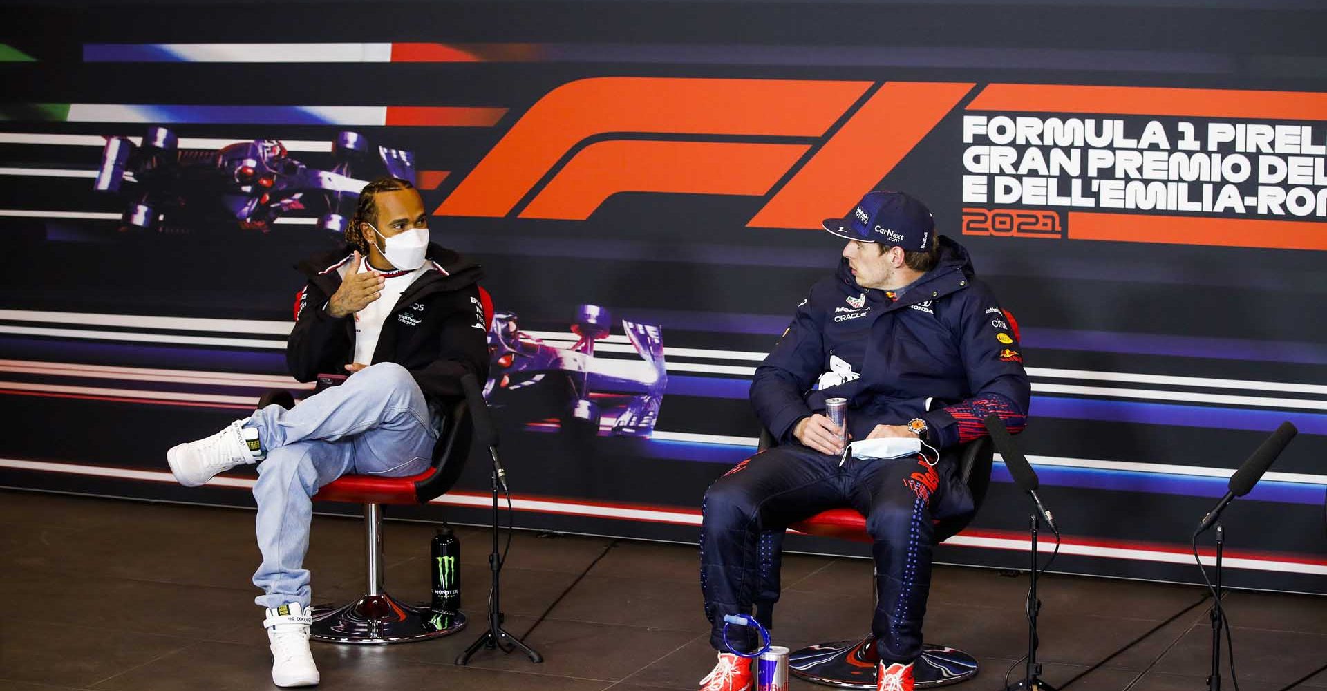 IMOLA, ITALY - APRIL 18: Second placed Lewis Hamilton of Great Britain and Mercedes GP talks with race winner Max Verstappen of Netherlands and Red Bull Racing in a press conference after the F1 Grand Prix of Emilia Romagna at Autodromo Enzo e Dino Ferrari on April 18, 2021 in Imola, Italy. (Photo by Florent Gooden - Pool/Getty Images)