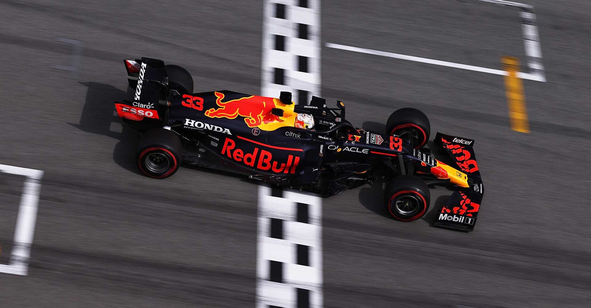 BARCELONA, SPAIN - MAY 09: Max Verstappen of the Netherlands driving the (33) Red Bull Racing RB16B Honda crosses the finish line for second place during the F1 Grand Prix of Spain at Circuit de Barcelona-Catalunya on May 09, 2021 in Barcelona, Spain. (Photo by Lars Baron/Getty Images)