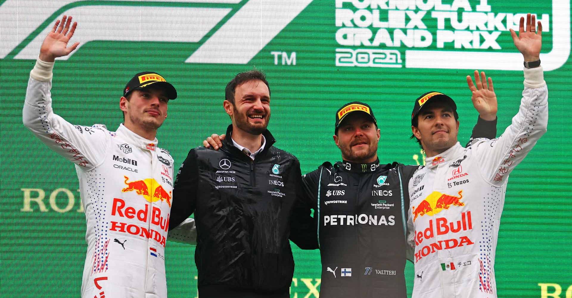 ISTANBUL, TURKEY - OCTOBER 10: Race winner Valtteri Bottas of Finland and Mercedes GP, second placed Max Verstappen of Netherlands and Red Bull Racing and third placed Sergio Perez of Mexico and Red Bull Racing celebrate on the podium during the F1 Grand Prix of Turkey at Intercity Istanbul Park on October 10, 2021 in Istanbul, Turkey. (Photo by Bryn Lennon/Getty Images)