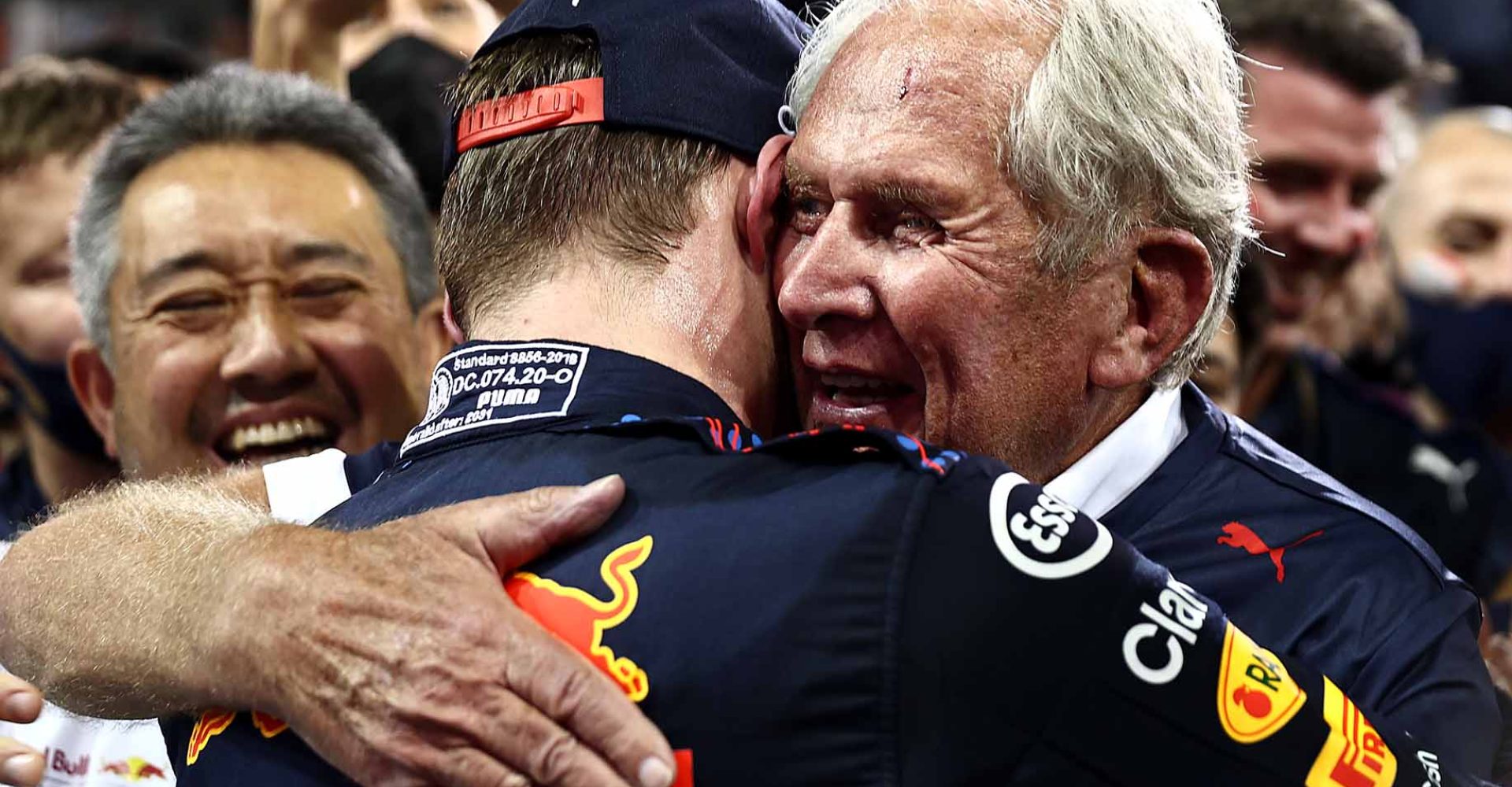 ABU DHABI, UNITED ARAB EMIRATES - DECEMBER 12: Race winner and 2021 F1 World Drivers Champion Max Verstappen of Netherlands and Red Bull Racing celebrates with Red Bull Racing Team Consultant Dr Helmut Marko in parc ferme during the F1 Grand Prix of Abu Dhabi at Yas Marina Circuit on December 12, 2021 in Abu Dhabi, United Arab Emirates. (Photo by Mark Thompson/Getty Images)