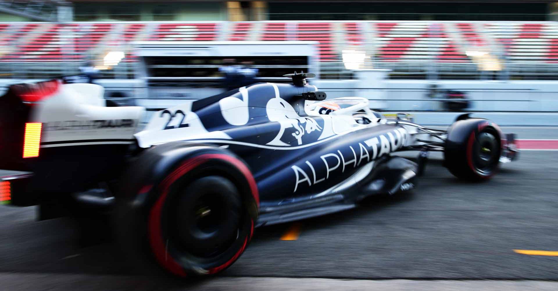 BARCELONA, SPAIN - FEBRUARY 23: Yuki Tsunoda of Japan driving the (22) Scuderia AlphaTauri AT03 leaves the garage during Day One of F1 Testing at Circuit de Barcelona-Catalunya on February 23, 2022 in Barcelona, Spain. (Photo by Peter Fox/Getty Images)