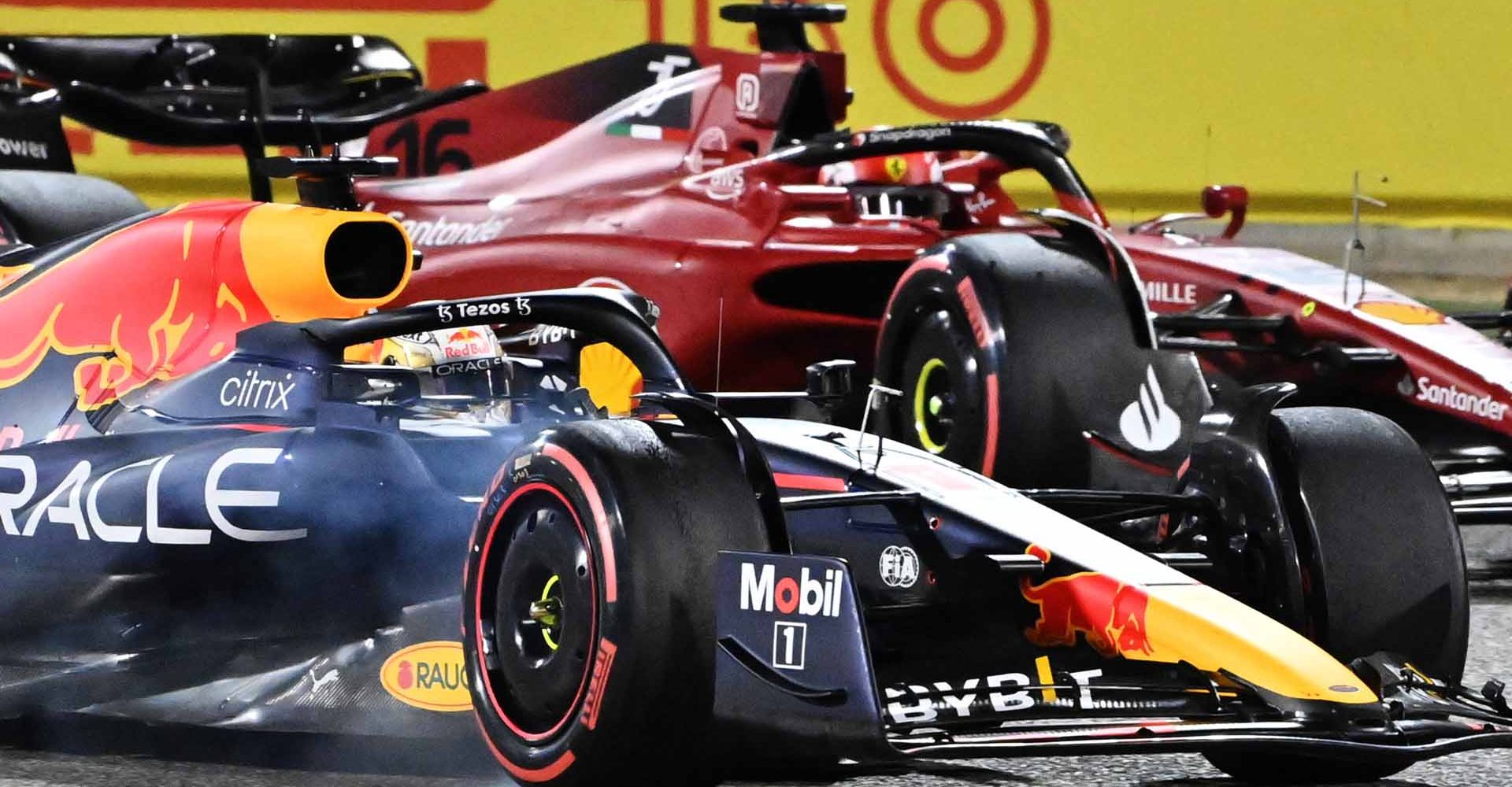 BAHRAIN, BAHRAIN - MARCH 20: Max Verstappen of the Netherlands driving the (1) Oracle Red Bull Racing RB18 overtakes Charles Leclerc of Monaco driving (16) the Ferrari F1-75 during the F1 Grand Prix of Bahrain at Bahrain International Circuit on March 20, 2022 in Bahrain, Bahrain. (Photo by Peter van Egmond/Getty Images)