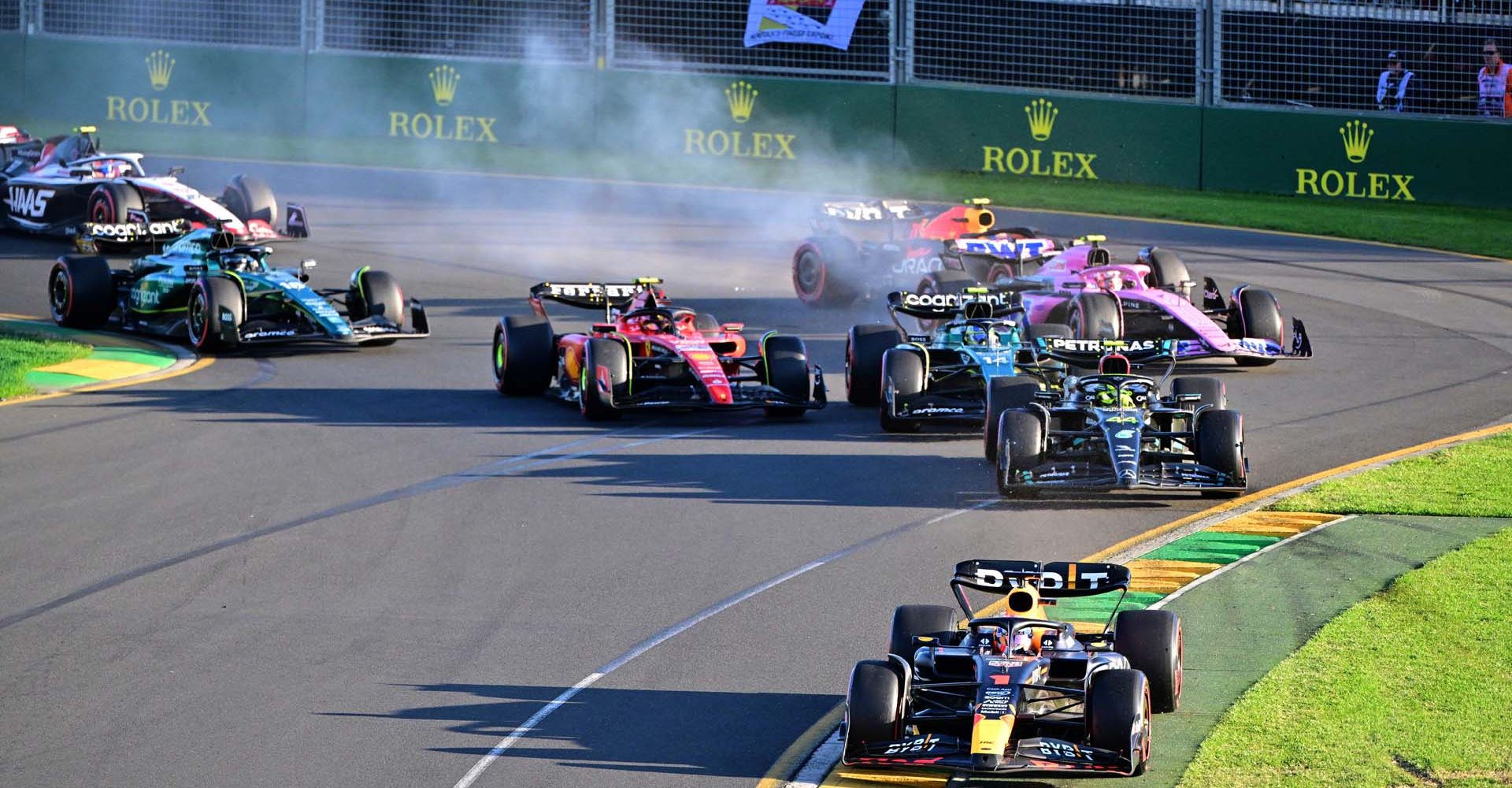 MELBOURNE, AUSTRALIA - APRIL 02: Max Verstappen of the Netherlands driving the (1) Oracle Red Bull Racing RB19 leads Lewis Hamilton of Great Britain driving the (44) Mercedes AMG Petronas F1 Team W14 and the rest of the field at the second restart during the F1 Grand Prix of Australia at Albert Park Grand Prix Circuit on April 02, 2023 in Melbourne, Australia. (Photo by Peter van Egmond/Getty Images)