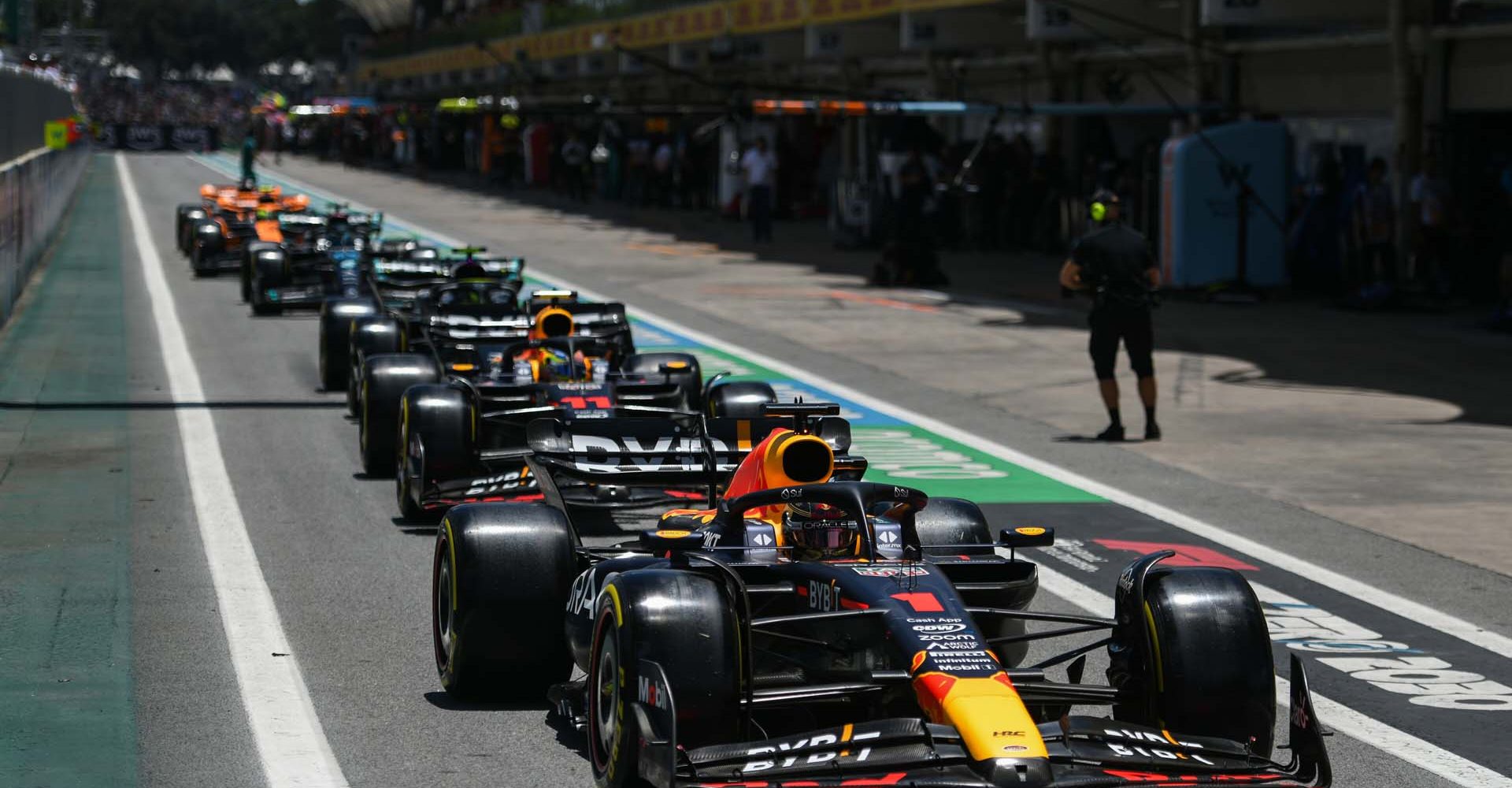 SAO PAULO, BRAZIL - NOVEMBER 04: Max Verstappen of the Netherlands driving the (1) Oracle Red Bull Racing RB19 leads a line of cars in the Pitlane during the Sprint Shootout ahead of the F1 Grand Prix of Brazil at Autodromo Jose Carlos Pace on November 04, 2023 in Sao Paulo, Brazil. (Photo by Rudy Carezzevoli/Getty Images) // Getty Images / Red Bull Content Pool // SI202311040247 // Usage for editorial use only //