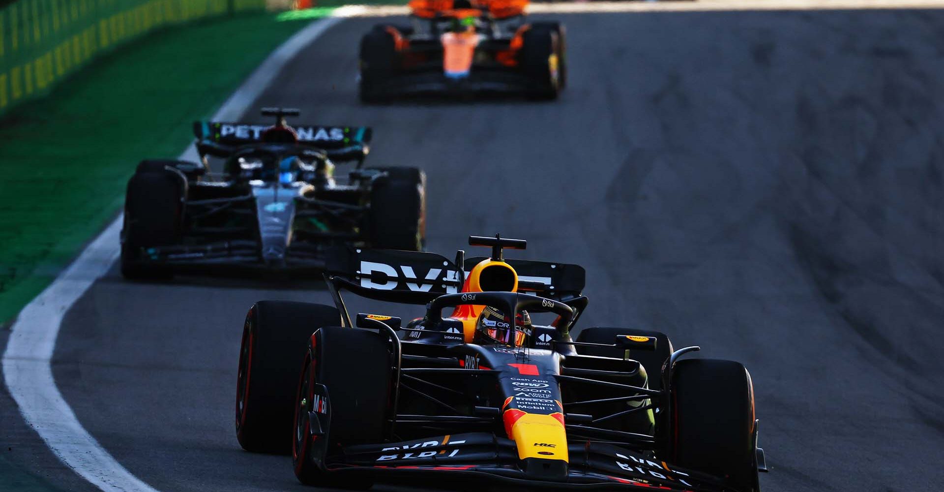 SAO PAULO, BRAZIL - NOVEMBER 04: Max Verstappen of the Netherlands driving the (1) Oracle Red Bull Racing RB19 leads George Russell of Great Britain driving the (63) Mercedes AMG Petronas F1 Team W14 on track during the Sprint ahead of the F1 Grand Prix of Brazil at Autodromo Jose Carlos Pace on November 04, 2023 in Sao Paulo, Brazil. (Photo by Mark Thompson/Getty Images) // Getty Images / Red Bull Content Pool // SI202311040319 // Usage for editorial use only //