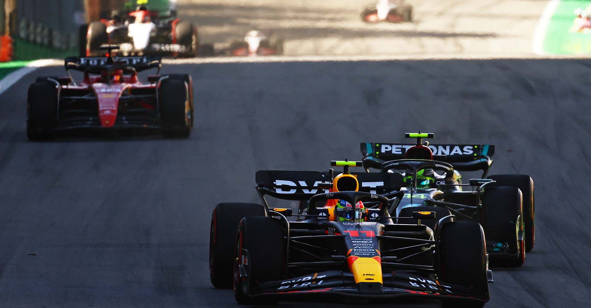 SAO PAULO, BRAZIL - NOVEMBER 04: Sergio Perez of Mexico driving the (11) Oracle Red Bull Racing RB19 leads Lewis Hamilton of Great Britain driving the (44) Mercedes AMG Petronas F1 Team W14 on track during the Sprint ahead of the F1 Grand Prix of Brazil at Autodromo Jose Carlos Pace on November 04, 2023 in Sao Paulo, Brazil. (Photo by Mark Thompson/Getty Images) // Getty Images / Red Bull Content Pool // SI202311040321 // Usage for editorial use only //