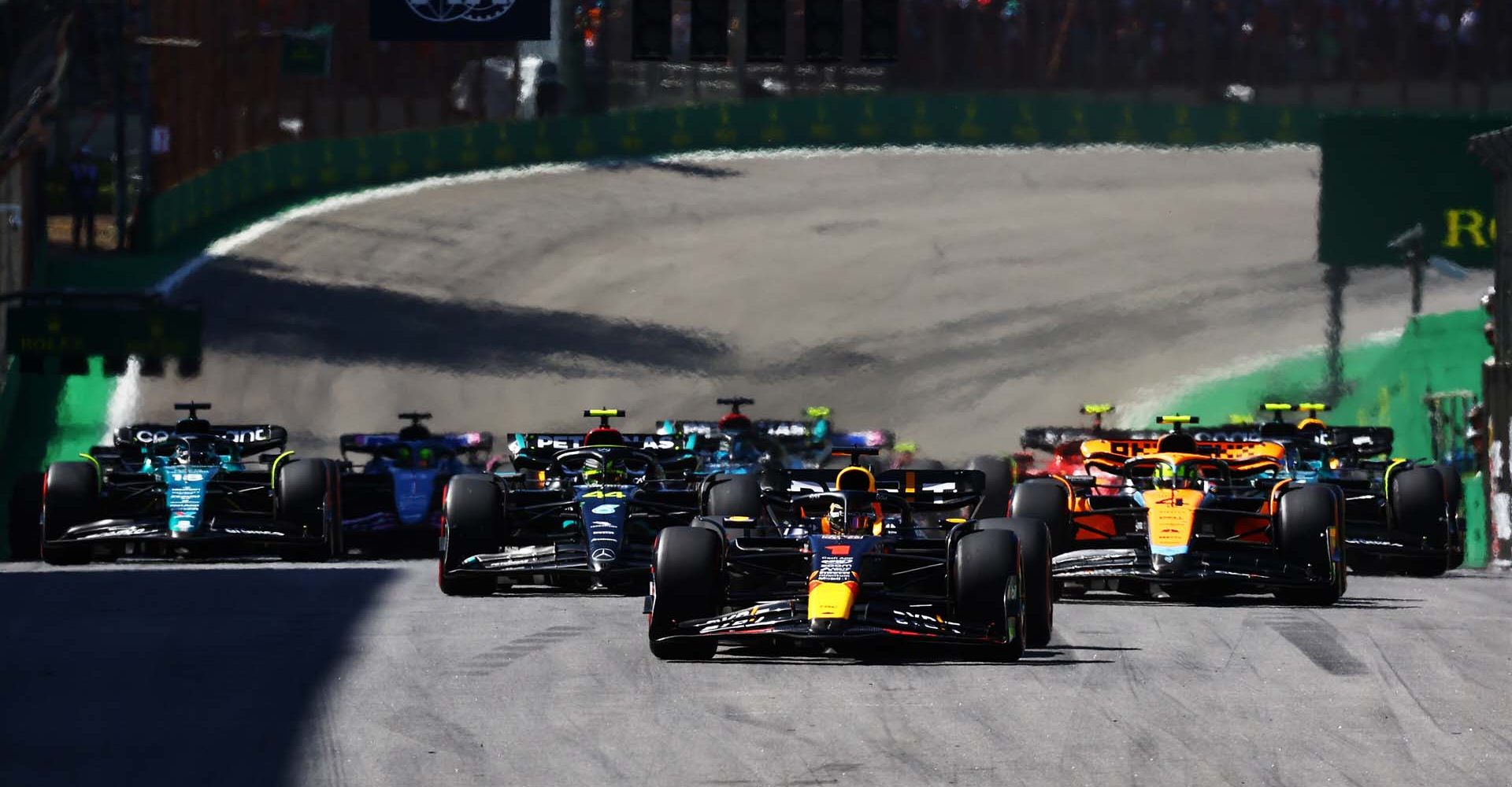 SAO PAULO, BRAZIL - NOVEMBER 05: Max Verstappen of the Netherlands driving the (1) Oracle Red Bull Racing RB19 leads Lewis Hamilton of Great Britain driving the (44) Mercedes AMG Petronas F1 Team W14 and Lando Norris of Great Britain driving the (4) McLaren MCL60 Mercedes at the restart after a red flag delay during the F1 Grand Prix of Brazil at Autodromo Jose Carlos Pace on November 05, 2023 in Sao Paulo, Brazil. (Photo by Mark Thompson/Getty Images) // Getty Images / Red Bull Content Pool // SI202311050577 // Usage for editorial use only //