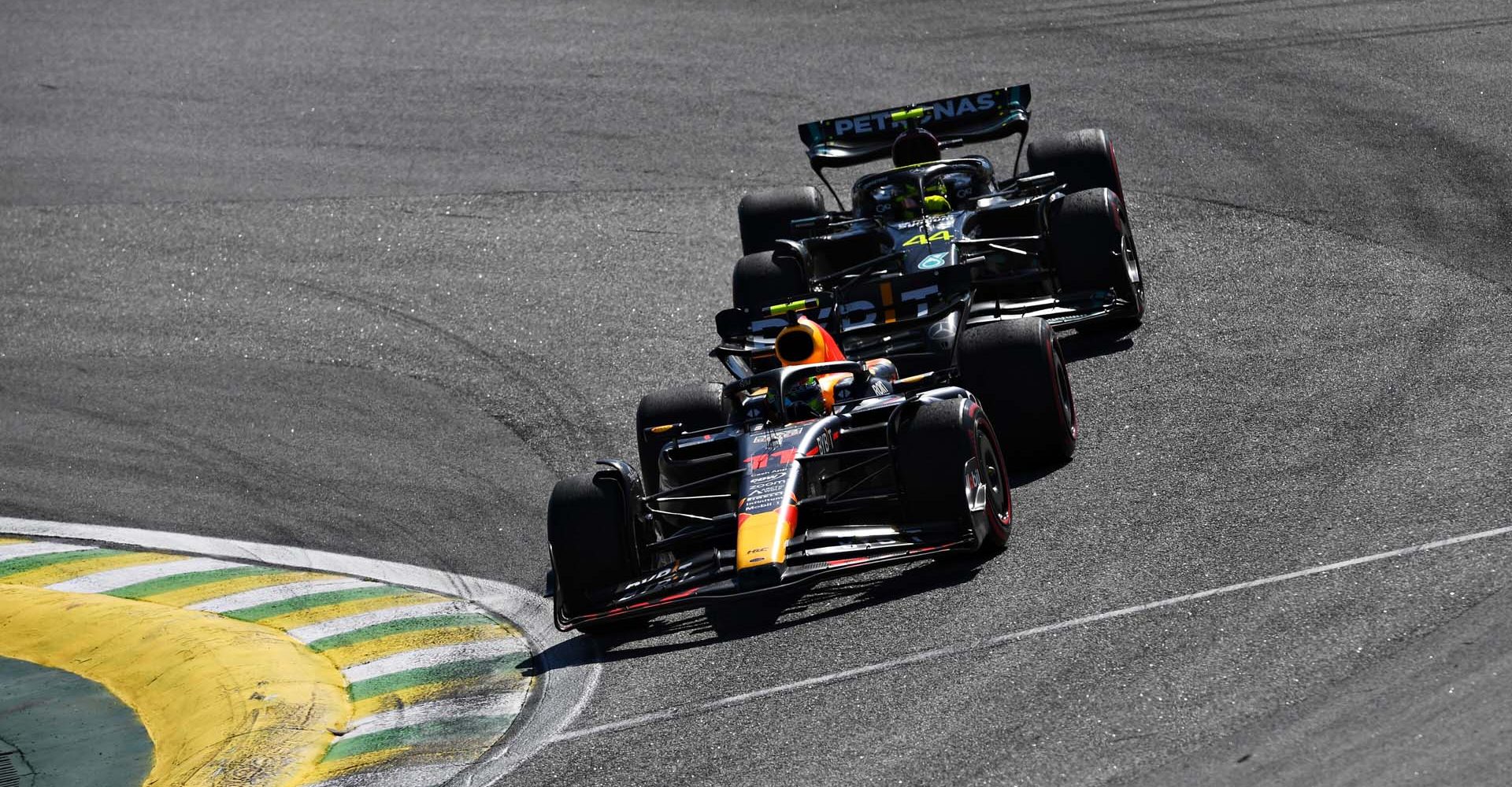 SAO PAULO, BRAZIL - NOVEMBER 05: Sergio Perez of Mexico driving the (11) Oracle Red Bull Racing RB19 leads Lewis Hamilton of Great Britain driving the (44) Mercedes AMG Petronas F1 Team W14 during the F1 Grand Prix of Brazil at Autodromo Jose Carlos Pace on November 05, 2023 in Sao Paulo, Brazil. (Photo by Rudy Carezzevoli/Getty Images) // Getty Images / Red Bull Content Pool // SI202311050624 // Usage for editorial use only //