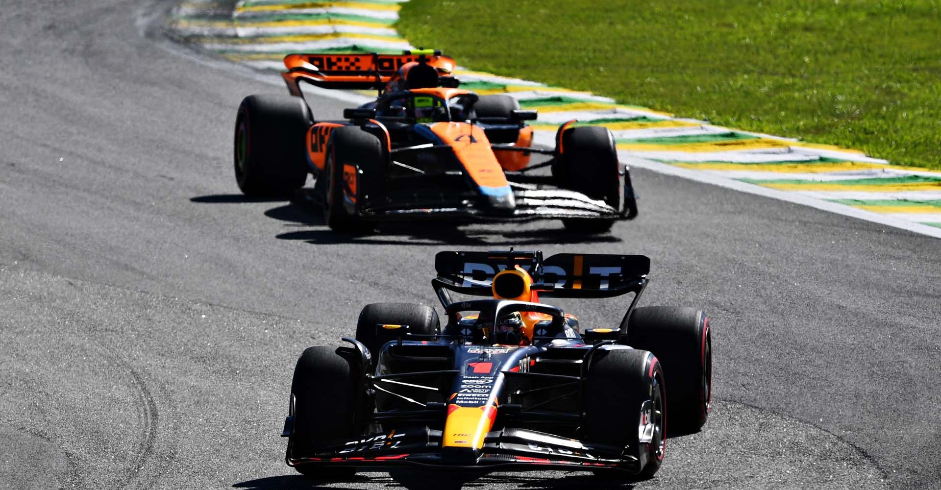 SAO PAULO, BRAZIL - NOVEMBER 05: Max Verstappen of the Netherlands driving the (1) Oracle Red Bull Racing RB19 leads Lando Norris of Great Britain driving the (4) McLaren MCL60 Mercedes during the F1 Grand Prix of Brazil at Autodromo Jose Carlos Pace on November 05, 2023 in Sao Paulo, Brazil. (Photo by Rudy Carezzevoli/Getty Images) // Getty Images / Red Bull Content Pool // SI202311050632 // Usage for editorial use only //