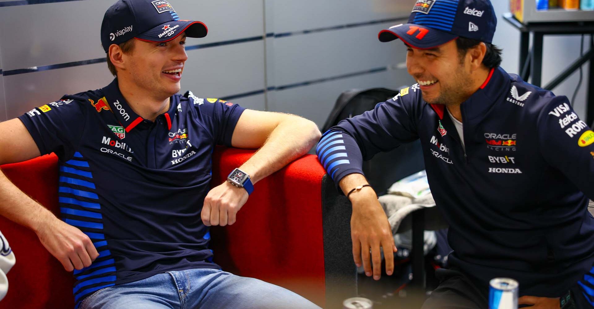 MILTON KEYNES, ENGLAND - FEBRUARY 15: Max Verstappen of the Netherlands and Oracle Red Bull Racing talks with Sergio Perez of Mexico and Oracle Red Bull Racing during the Oracle Red Bull Racing RB20 car launch at Red Bull Racing Factory on February 15, 2024 in Milton Keynes, England. (Photo by Mark Thompson/Getty Images for Red Bull Racing) // SI202402150743 // Usage for editorial use only //