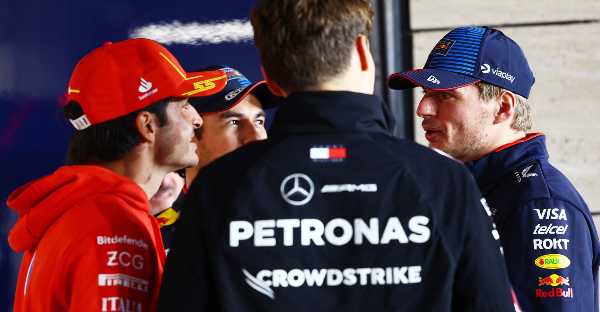 LUSAIL CITY, QATAR - DECEMBER 01: Max Verstappen of the Netherlands and Oracle Red Bull Racing talks with Carlos Sainz of Spain and Ferrari and George Russell of Great Britain and Mercedes on the drivers parade prior to the F1 Grand Prix of Qatar at Lusail International Circuit on December 01, 2024 in Lusail City, Qatar. (Photo by Mark Thompson/Getty Images) // Getty Images / Red Bull Content Pool // SI202412010150 // Usage for editorial use only //