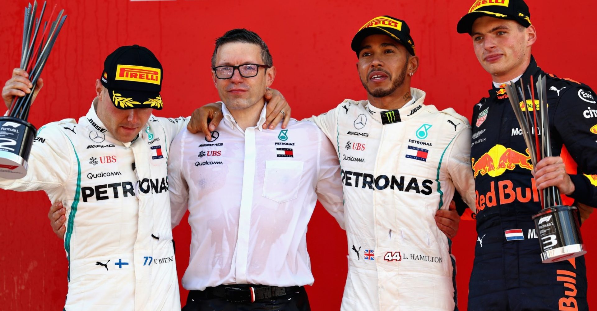 MONTMELO, SPAIN - MAY 13: Top three finishers Lewis Hamilton of Great Britain and Mercedes GP, Valtteri Bottas of Finland and Mercedes GP and Max Verstappen of Netherlands and Red Bull Racing celebrate on the podium with Mercedes race engineer Peter Bonnington during the Spanish Formula One Grand Prix at Circuit de Catalunya on May 13, 2018 in Montmelo, Spain.  (Photo by Mark Thompson/Getty Images)