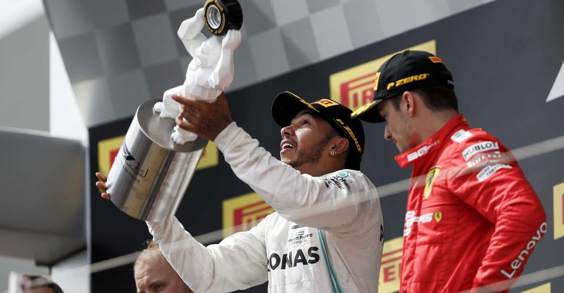 CIRCUIT PAUL RICARD, FRANCE - JUNE 23: Lewis Hamilton, Mercedes AMG F1, 1st position, celebrates with his trophy with Charles Leclerc, Ferrari, 3rd position, alongside during the French GP at Circuit Paul Ricard on June 23, 2019 in Circuit Paul Ricard, France. (Photo by Zak Mauger / LAT Images)